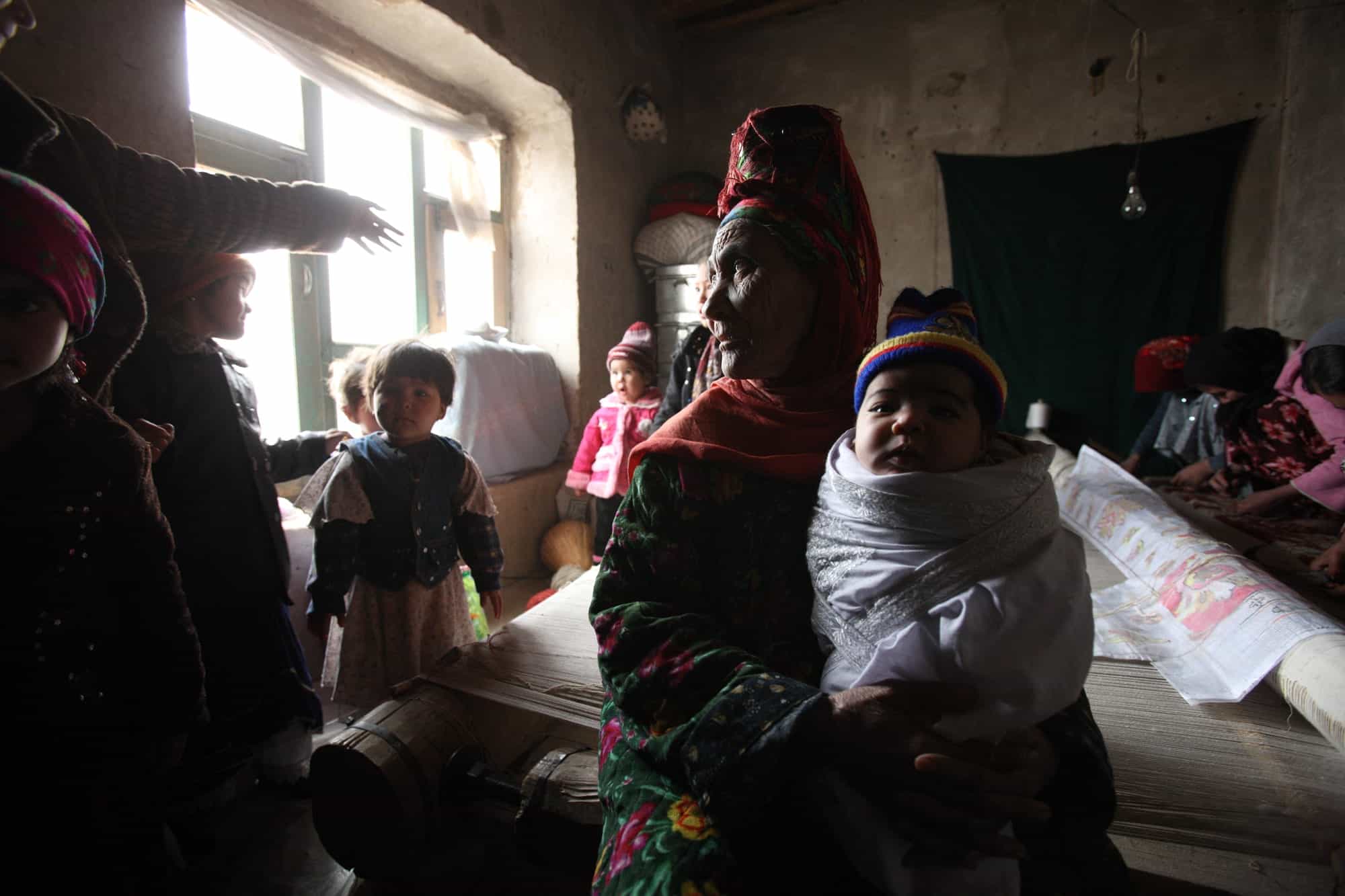 Turkman villagers produce woven textiles and carpets in Sheberghan, in the Jowzjan Province of Northern Afghanistan, Monday, January 26, 2010.